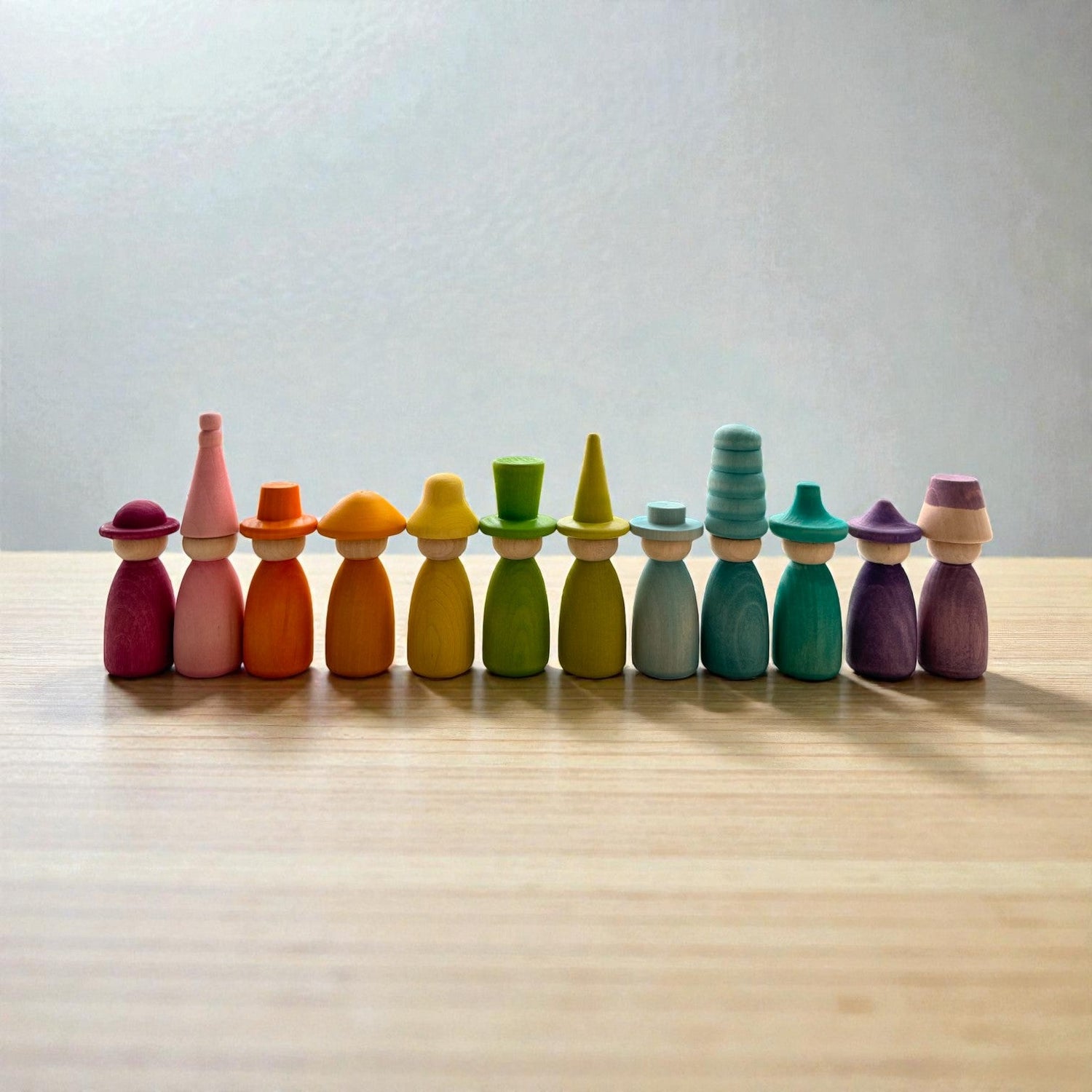 12 Piece Pastel Macaron Wooden Peg Dolls with Interchangeable Hats Open Ended Play Figures