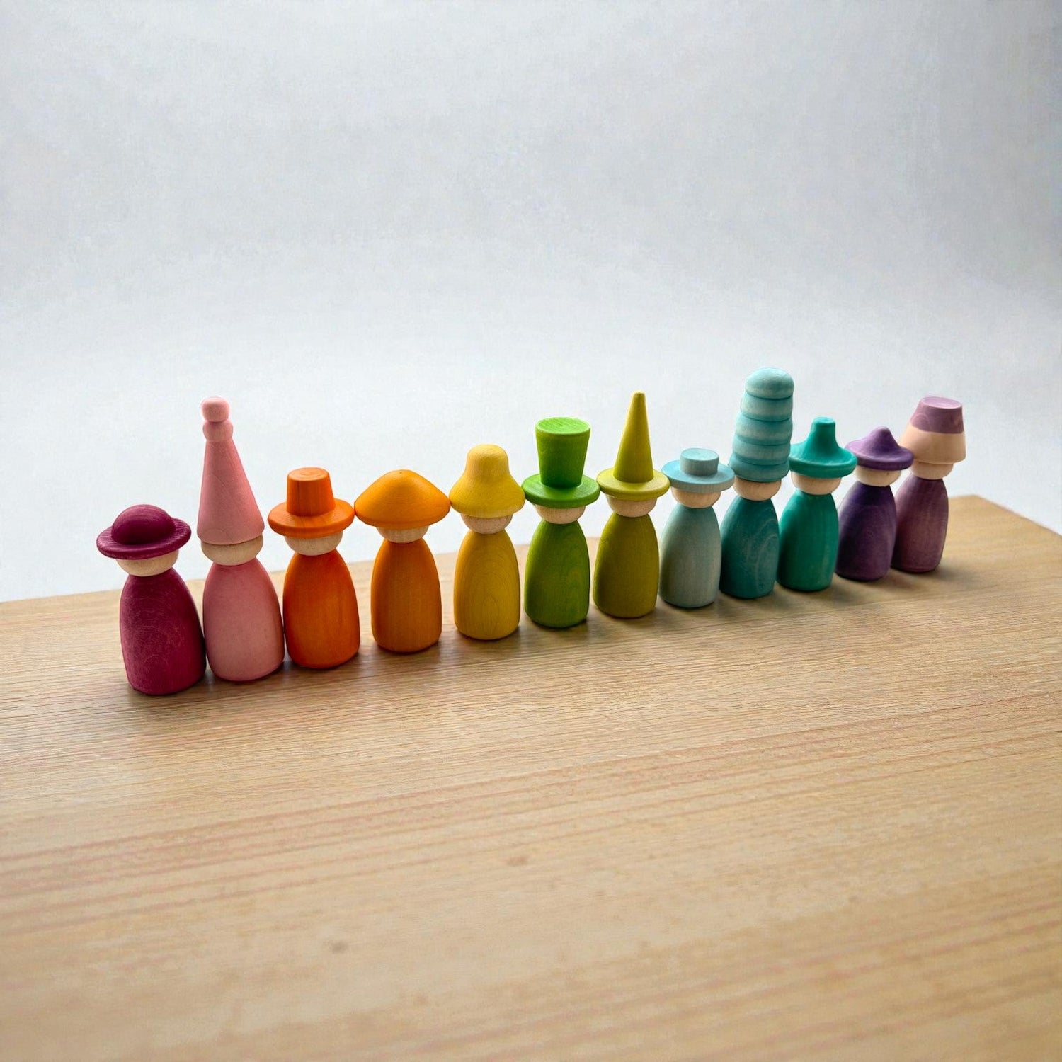 12 Piece Pastel Macaron Wooden Peg Dolls with Interchangeable Hats Open Ended Play Figures